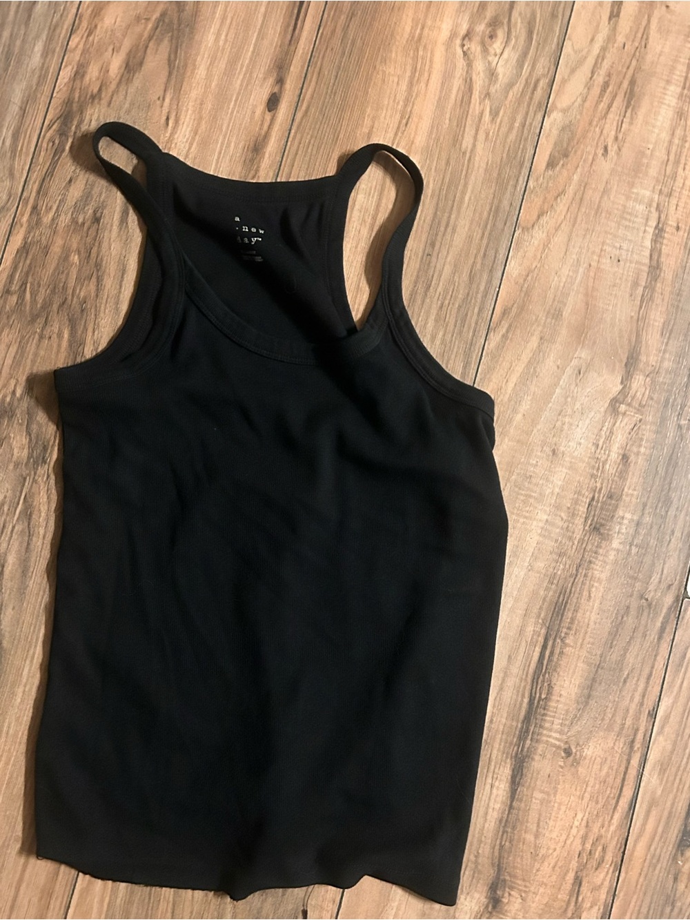 a new day Black Racerback Tank Top